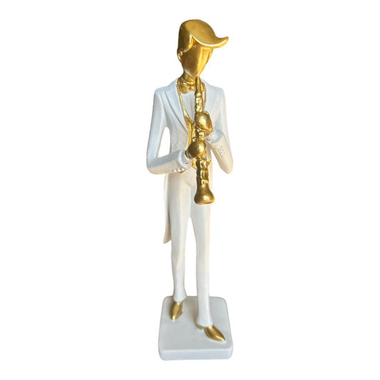 GENTLEMAN IN WHITE TUX PLAYING TRUMPET