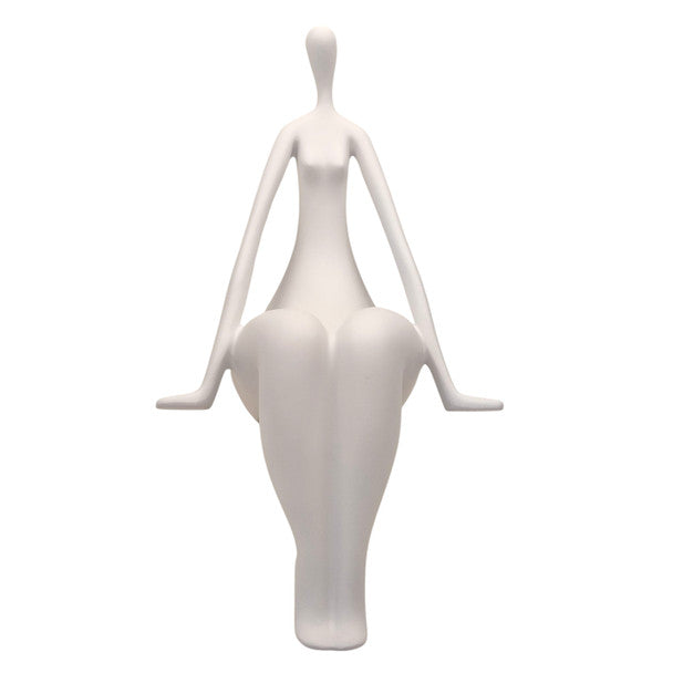 WHITE SPECKLED LADY SITTING ON LEDGE